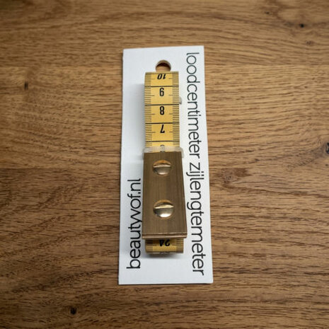 Loodcentimeter 200cm zijlengtemeter op houten ondergrond - Side-length tailor measuring tape 200cm on wooden background